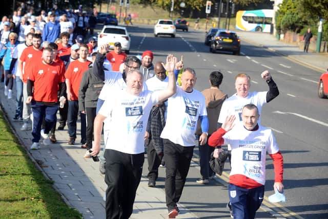 Michael Ganley (left) and other walkers on their way to Roker.