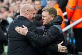 Everton's English manager Sean Dyche (L) and Newcastle United's English head coach Eddie Howe hug each other at the start of the English Premier League football match between Newcastle United and Everton at St James' Park in Newcastle-upon-Tyne, north east England on April 2, 2024. (Photo by Andy Buchanan / AFP) 