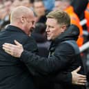Everton's English manager Sean Dyche (L) and Newcastle United's English head coach Eddie Howe hug each other at the start of the English Premier League football match between Newcastle United and Everton at St James' Park in Newcastle-upon-Tyne, north east England on April 2, 2024. (Photo by Andy Buchanan / AFP) 