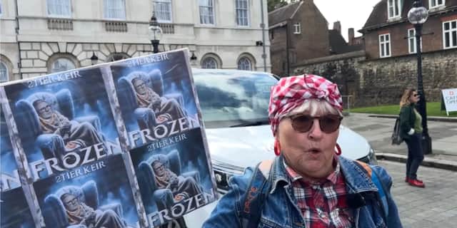 Protester speaks at winter fuel cuts rally.