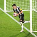 Johnny Emerson of Newcastle United U21 collects the ball after scoring his teams first goal during the Bristol Street Motors Trophy match between Rotherham United and Newcastle United U21 at AESSEAL New York Stadium on October 08, 2024 in Rotherham, England. (Photo by George Wood/Getty Images)