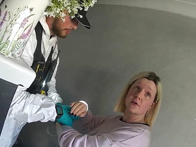 Virginia McCullough is arrested by police.
