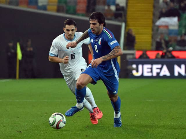 Italy's midfielder #08 Sandro Tonali (C, r) fights for the ball with Israel's midfielder #15 Oscar Gloukh (C, l) during the UEFA Nations League, Ligue A Group A2 football match between Italy and Israel at the Friuli stadium in Udine, on October 14, 2024. (Photo by Tiziana FABI / AFP) (Photo by TIZIANA FABI/AFP via Getty Images)