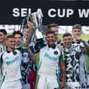Players of Newcastle United lift the Sela cup during the Pre-Season Friendly between Newcastle United and Stade Brestois  at St James' Park on August 10, 2024 in Newcastle upon Tyne, England.
