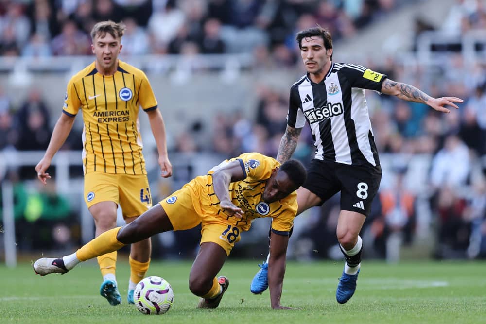 Danny Welbeck of Brighton & Hove Albion goes down against Sandro Tonali of Newcastle United. (Photo by Matt McNulty/Getty Images)