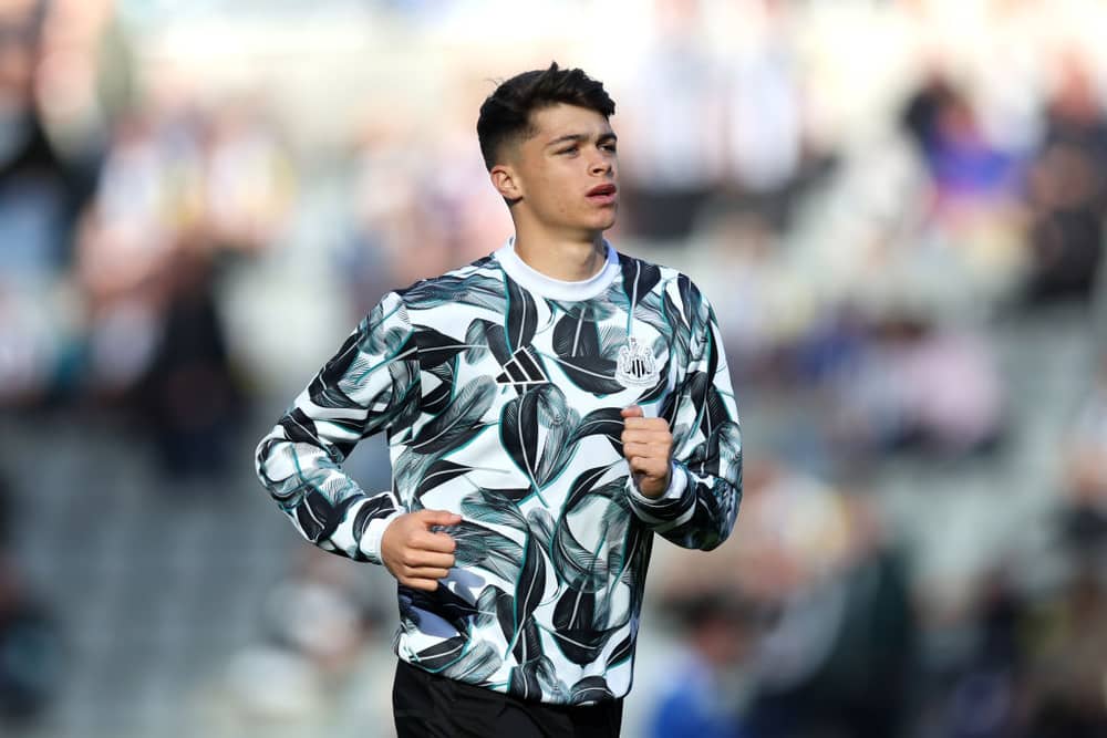 Lewis Miley of Newcastle United warms up prior to the Premier League match between Newcastle United FC and Brighton & Hove Albion FC at St James' Park on October 19, 2024 in Newcastle upon Tyne, England. (Photo by George Wood/Getty Images)