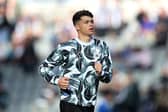 Lewis Miley of Newcastle United warms up prior to the Premier League match between Newcastle United FC and Brighton & Hove Albion FC at St James' Park on October 19, 2024 in Newcastle upon Tyne, England. (Photo by George Wood/Getty Images)