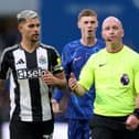 Cole Palmer of Chelsea and Bruno Guimaraes of Newcastle United react towards Referee Simon Hooper after he reverses his original decision of 'penalty' following a VAR review during the Premier League match between Chelsea FC and Newcastle United FC at Stamford Bridge on October 27, 2024 in London, England. (Photo by Ryan Pierse/Getty Images)