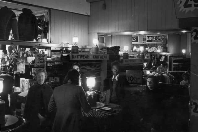 Customers do their Christmas shopping in semi-darkness during an electricity strike in December 1973.