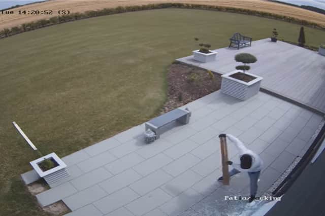 Burglar breaks into home by smashing patio doors with hammer.