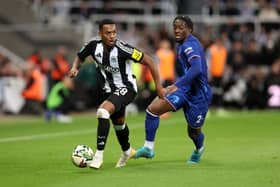 Joe Willock of Newcastle United is challenged by Axel Disasi of Chelsea during the Carabao Cup Fourth Round match between Newcastle United and Chelsea at St James' Park. (Photo by George Wood/Getty Images)