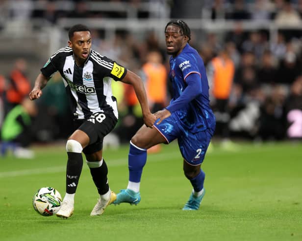 Joe Willock of Newcastle United is challenged by Axel Disasi of Chelsea during the Carabao Cup Fourth Round match between Newcastle United and Chelsea at St James' Park. (Photo by George Wood/Getty Images)