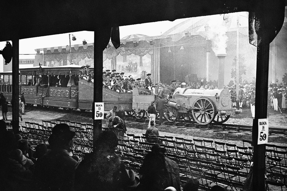 The Stephenson locomotive, Northumbrian, hauling a train carrying passengers and a brass band in Liverpool in 1930.
