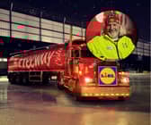 ‘Nick’ brings the Lidl cola truck to life. He is seen ticking off his list and loading up present boxes, in the Christmas ad campaign.
