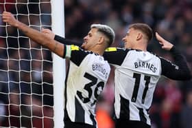 Bruno Guimaraes and Harvey Barnes celebrating for Newcastle United. 