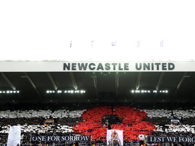 General view inside the stadium as fans display a mosaic of a poppy and banners reading "One For Sorrow" and "Lest We Forget" as they observe a minutes silence ahead of Remembrance Day prior to the Premier League match between Newcastle United FC and Arsenal FC at St James' Park on November 02, 2024 in Newcastle upon Tyne, England. 