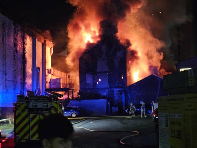 Firefighters tackling a huge fire at the former Dog Inn on Church Street, Preston