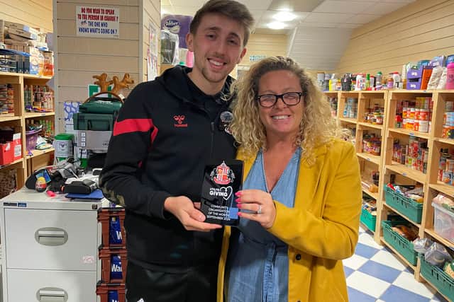Sunderland AFC captain Dan Neil with Angie Comerford, the co-founder of Hebburn Helps.