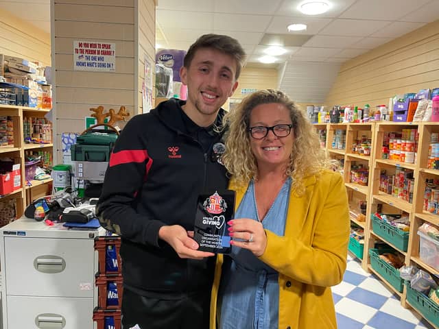 Sunderland AFC captain Dan Neil with Angie Comerford, the co-founder of Hebburn Helps.