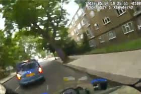 Thug rams police officer off his bike during high-speed pursuit.