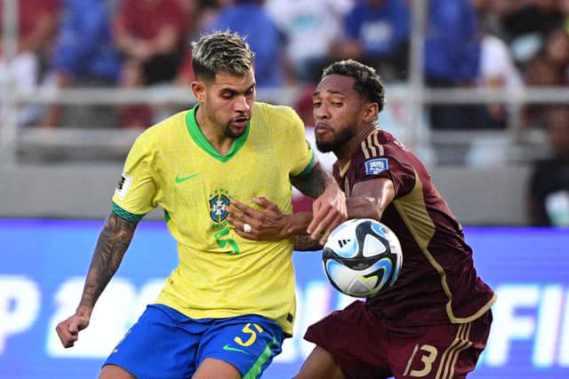 Brazil's midfielder #05 Bruno Guimaraes and Venezuela's midfielder #13 Jose Martinez fight for the ball during the 2026 FIFA World Cup South American qualifiers football match between Venezuela and Brazil at the Monumental stadium in Maturin, Monagas State, Venezuela, on November 14, 2024. (Photo by Federico Parra / AFP) (Photo by FEDERICO PARRA/AFP via Getty Images)