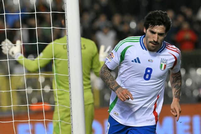 Italy's midfielder #08 Sandro Tonali celebrates scoring his team's first goal during the UEFA Nations League Group A2 football match between Belgium and Italy at the King Baudouin Stadium in Brussels on November 14, 2024. (Photo by NICOLAS TUCAT / AFP) (Photo by NICOLAS TUCAT/AFP via Getty Images)