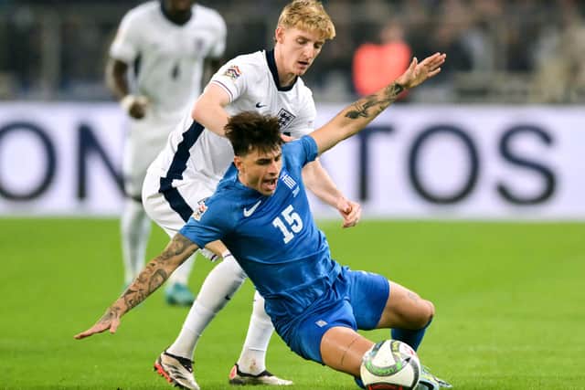 England's forward  #11 Anthony Gordon (L) fights for the ball with Greece's defender #15 Lazaros Rota (R) during the UEFA Nations League, League B group B2 football match between Greece and England at Olympic Athletic Center of Athens "Spyros Louis" stadium in Athens, on November 14, 2024. (Photo by Angelos Tzortzinis / AFP) (Photo by ANGELOS TZORTZINIS/AFP via Getty Images)