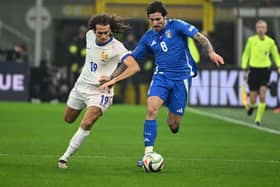 France's midfielder #19 Matteo Guendouzi (L) fights for the ball with Italy's midfielder #08 Sandro Tonali during the Nations League group A2 football match between Italy and France at San Siro stadium in Milan, on November 17, 2024. (Photo by Alberto PIZZOLI / AFP) (Photo by ALBERTO PIZZOLI/AFP via Getty Images)