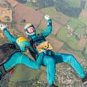 Parachuters performed mid-air manoeuvres which saw the bright turquoise liquid shaken and stirred from heights up to 10,000ft