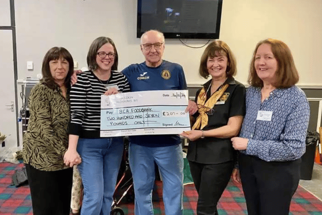Committee members from Boldon Blossoms WI presenting a cheque to Gordon and Leanne at the Boldon Community Association Foodbank.
