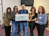 Committee members from Boldon Blossoms WI presenting a cheque to Gordon and Leanne at the Boldon Community Association Foodbank.