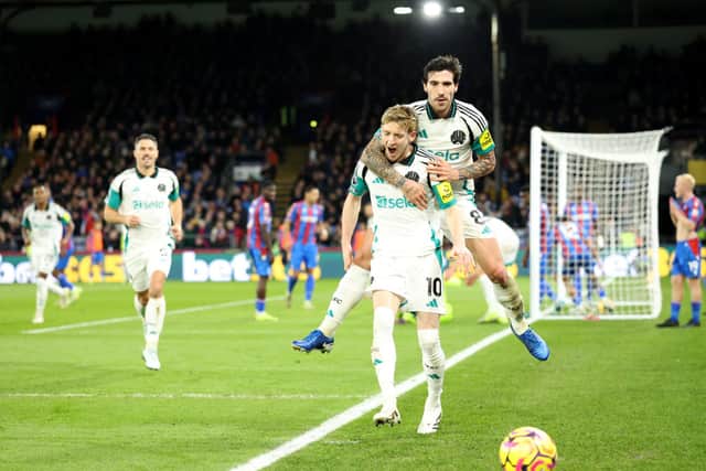 Anthony Gordon of Newcastle United celebrates with teammate Sandro Tonali after Marc Guehi of Crystal Palace (not pictured) scores an own-goal during the Premier League match between Crystal Palace FC and Newcastle United FC at Selhurst Park on November 30, 2024 in London, England. (Photo by Richard Pelham/Getty Images)