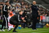 Eddie Howe, Manager of Newcastle United, reacts as Arne Slot, Manager of Liverpool, looks on during the Premier League match. (Photo by Stu Forster/Getty Images)