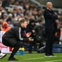 Eddie Howe, Manager of Newcastle United, reacts as Arne Slot, Manager of Liverpool, looks on during the Premier League match. (Photo by Stu Forster/Getty Images)