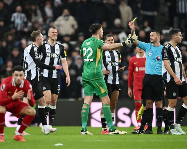 Nick Pope of Newcastle United reacts as he is shown a yellow card by Referee Andy Madley during the Premier League match between Newcastle United FC and Liverpool FC at St James' Park on December 04, 2024 in Newcastle upon Tyne, England. (Photo by Stu Forster/Getty Images)