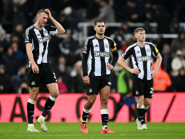 Dan Burn, Bruno Guimaraes and Lewis Hall of Newcastle United react after drawing with Liverpool during the Premier League match between Newcastle United FC and Liverpool FC at St James' Park on December 04, 2024 in Newcastle upon Tyne, England. (Photo by Stu Forster/Getty Images)
