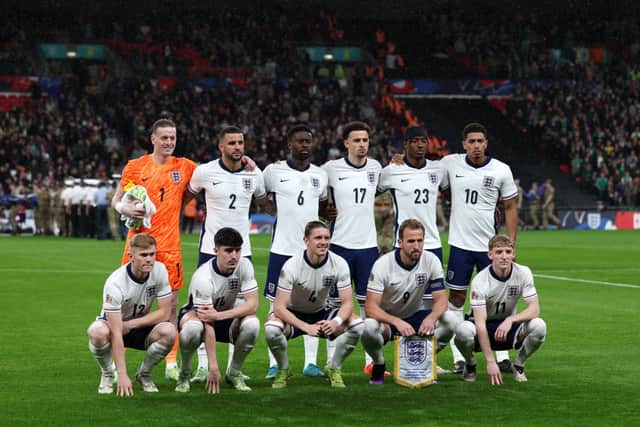 (From L top to bottom) England's goalkeeper #01 Jordan Pickford, England's defender #02 Kyle Walker, England's defender #06 Marc Guehi, England's midfielder #17 Curtis Jones, England's striker #23 Noni Madueke, England's midfielder #10 Jude Bellingham, England's defender #12 Lewis Hall, England's defender #14 Tino Livramento, England's midfielder #04 Conor Gallagher, England's striker #09 Harry Kane and England's midfielder #11 Anthony Gordon pose for a team photo before the UEFA Nations League, League B - Group 2, football match between England and the Republic of Ireland at Wembley Stadium in London on November 17, 2024. (Photo by ADRIAN DENNIS/AFP via Getty Images)