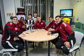 Newcastle Players and Staff visit the RVI Hospital on their annual hospital visits on December 10, 2024 in Newcastle upon Tyne, England. (Photo by Serena Taylor/Newcastle United via Getty Images)