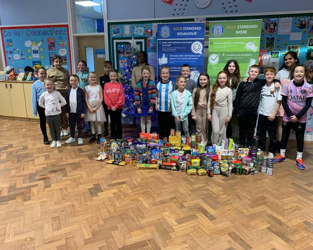 Pupils at West Boldon Primary School with their donations from their 'Boldon in Need' non-uniform day.