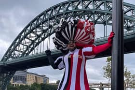 Colin Burgin-Plews in one of his many amazing dresses that he has used to raise money for charity.