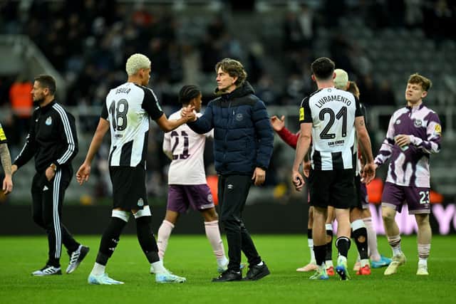 William Osula of Newcastle United shakes hands with Thomas Frank, Manager of Brentford, after the Carabao Cup Quarter Final match between Newcastle United and Brentford at St James' Park. (Photo by Michael Regan/Getty Images)