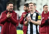 A smiling Matt Targett of Newcastle United applauds the fans following 3-0 win over Aston Villa. (Photo by Stu Forster/Getty Images)