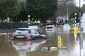 Cars stranded in deep water due to flooding in Stockport.
