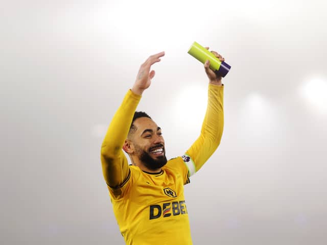 Matheus Cunha of Wolverhampton Wanderers shows appreciation to the fans whilst holding the player of the match award following victory in the Premier League match between Wolverhampton Wanderers FC and Manchester United FC at Molineux on December 26, 2024 in Wolverhampton, England.