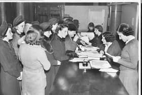 A food rationing scene from January 1940