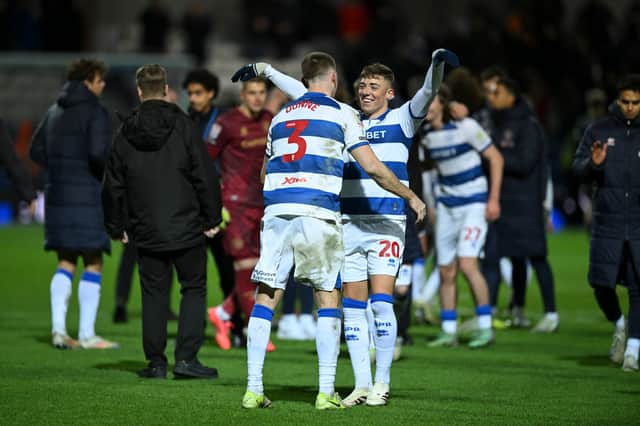 Ashby celebrated with Jimmy Dunne following QPR’s victory over Norwich City.