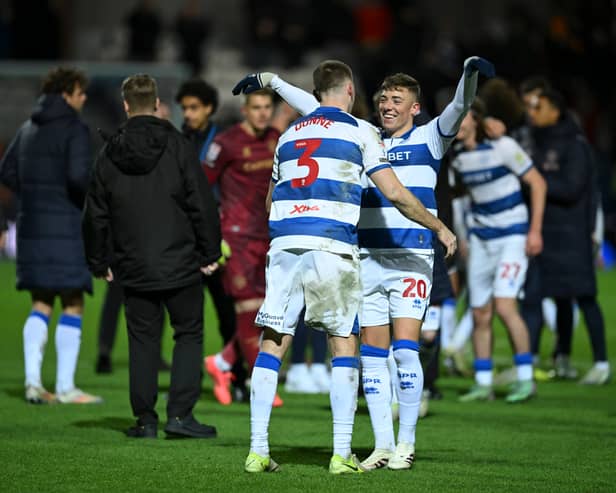 Ashby celebrated with Jimmy Dunne following QPR’s victory over Norwich City.
