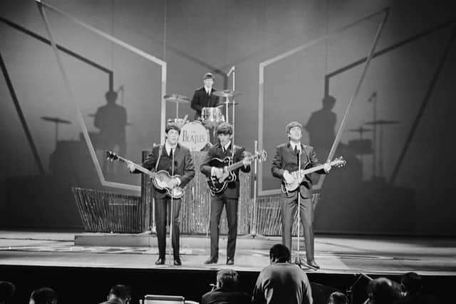 The Beatles performing in 1963 at the London Palladium