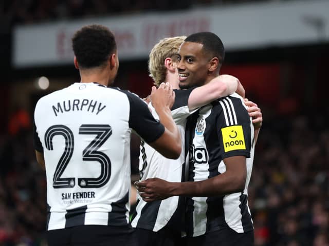 Alexander Isak of Newcastle United celebrates with teammates Anthony Gordon and Jacob Murphy after scoring his team's first goal during the Carabao Cup Semi Final First Leg match between Arsenal and Newcastle United at Emirates Stadium on January 07, 2025 in London, England. (Photo by Alex Pantling/Getty Images)