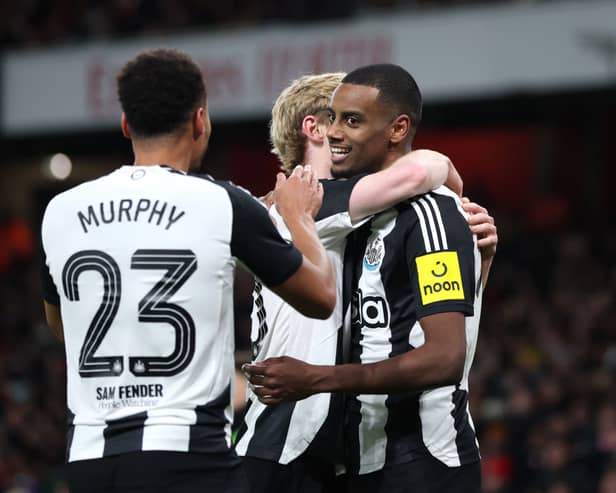 Alexander Isak of Newcastle United celebrates with teammates Anthony Gordon and Jacob Murphy after scoring his team's first goal during the Carabao Cup Semi Final First Leg match between Arsenal and Newcastle United at Emirates Stadium on January 07, 2025 in London, England. (Photo by Alex Pantling/Getty Images)